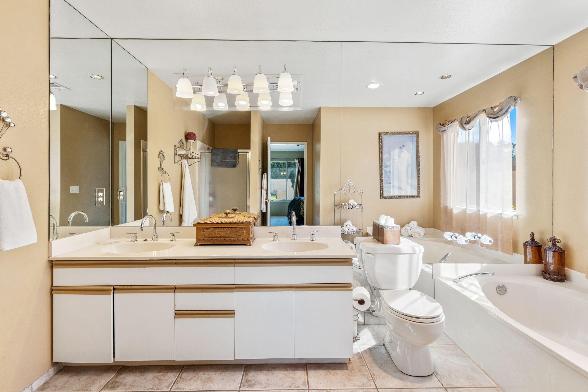 39795 Regency Way Palm Desert, CA 92211 - Photo 26 of 39 a bathroom with a double vanity sink mirror and