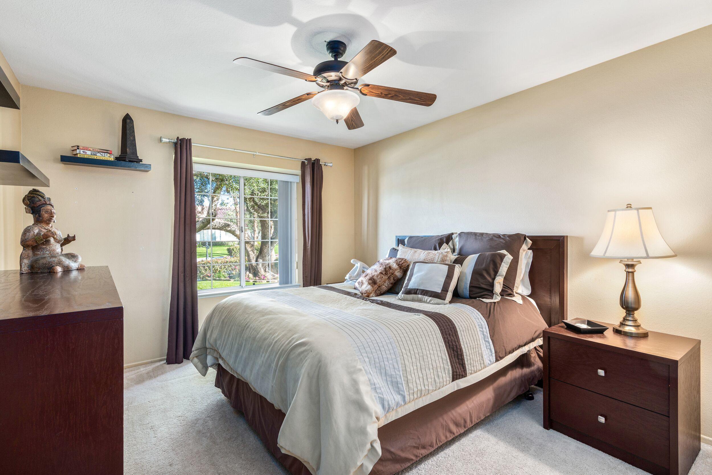 39795 Regency Way Palm Desert, CA 92211 - Photo 28 of 39 a bedroom with a bed and window