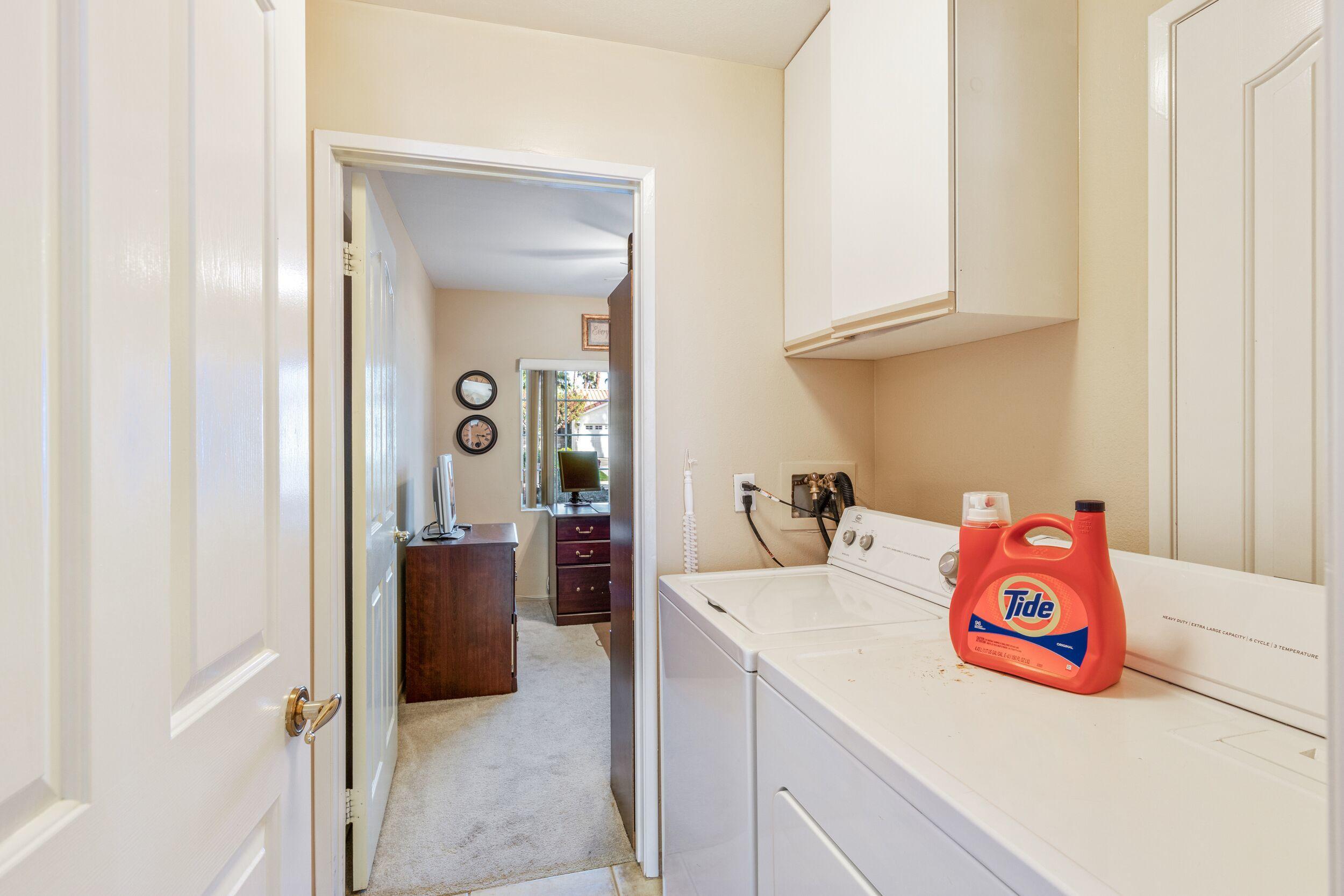 39795 Regency Way Palm Desert, CA 92211 - Photo 30 of 39 a kitchen with a sink and a refrigerator