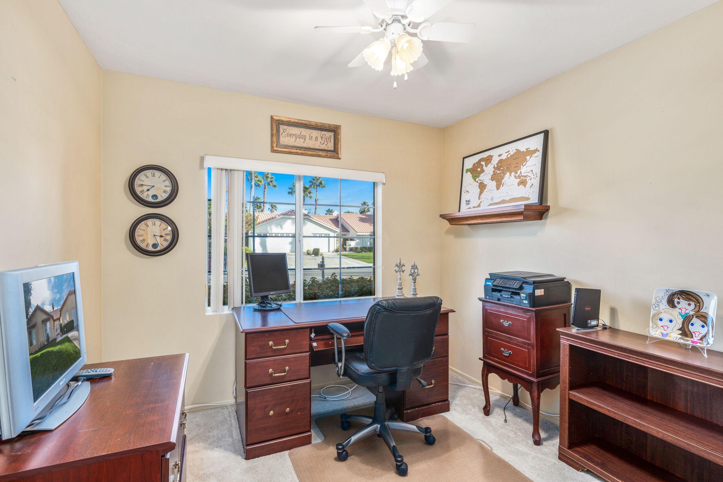 39795 Regency Way Palm Desert, CA 92211 - Photo 31 of 39 a view of a workspace with furniture and wooden floor