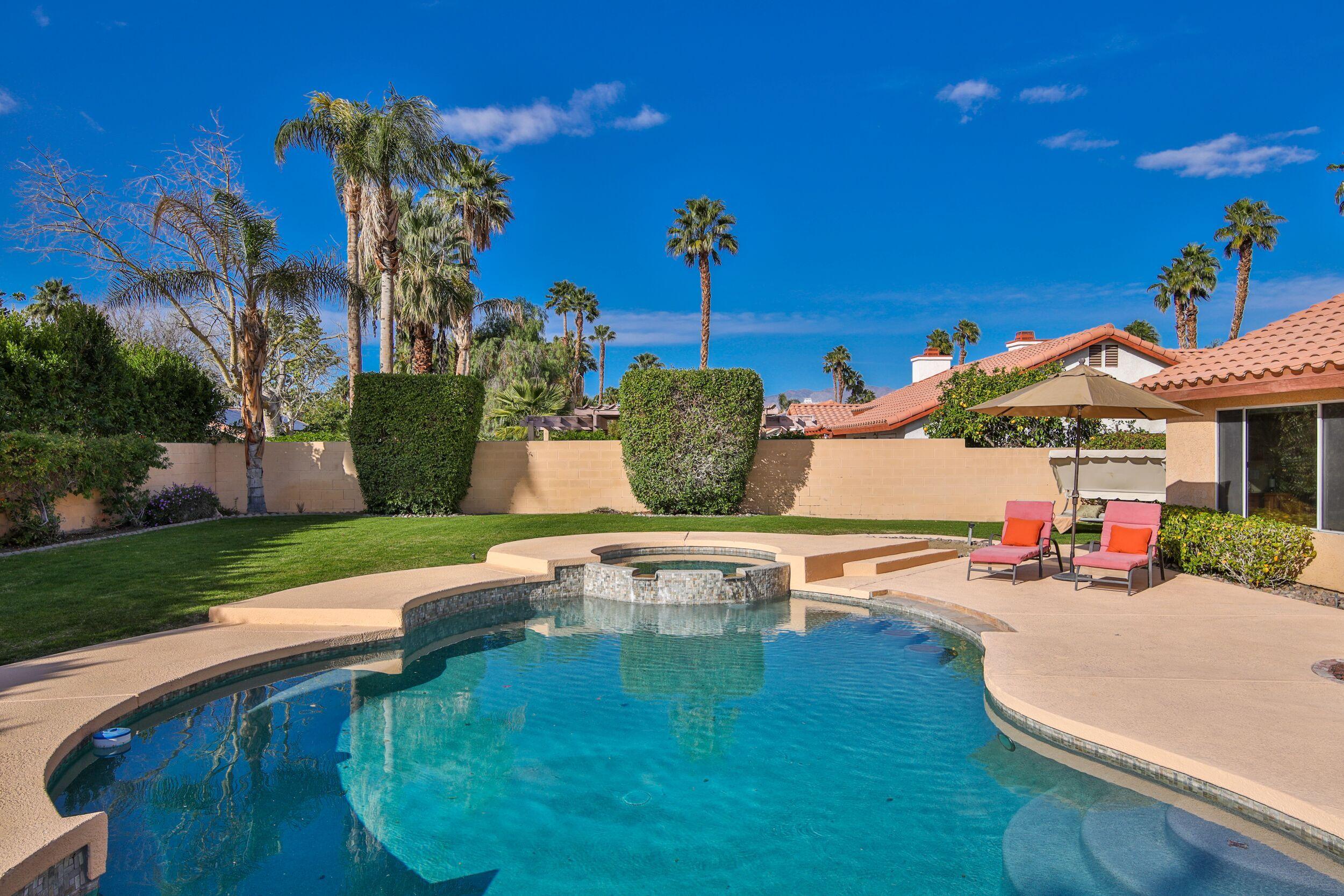 39795 Regency Way Palm Desert, CA 92211 - Photo 38 of 39 a view of a swimming pool with a patio