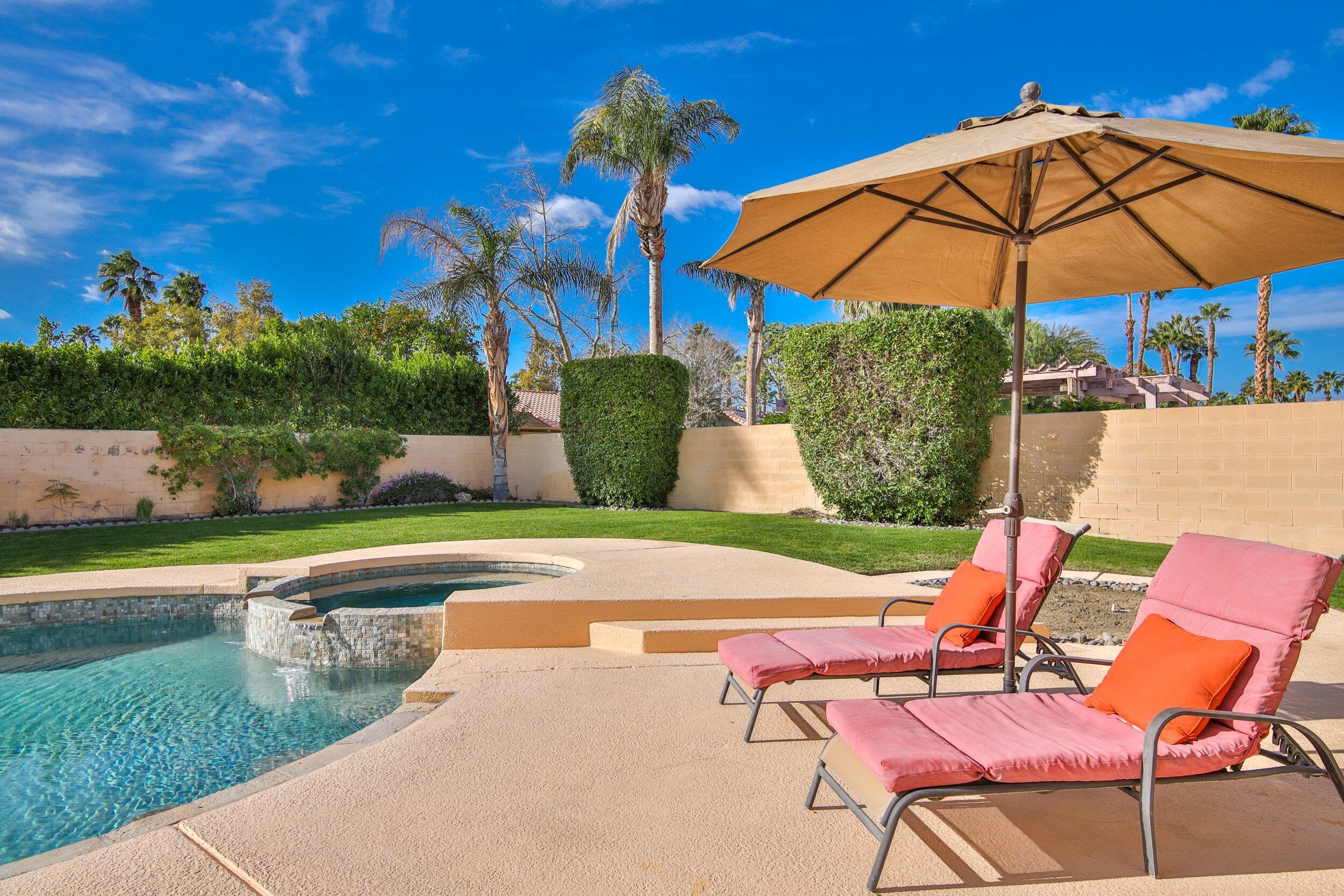 39795 Regency Way Palm Desert, CA 92211 - Photo 39 of 39 a patio with a yard table and chairs