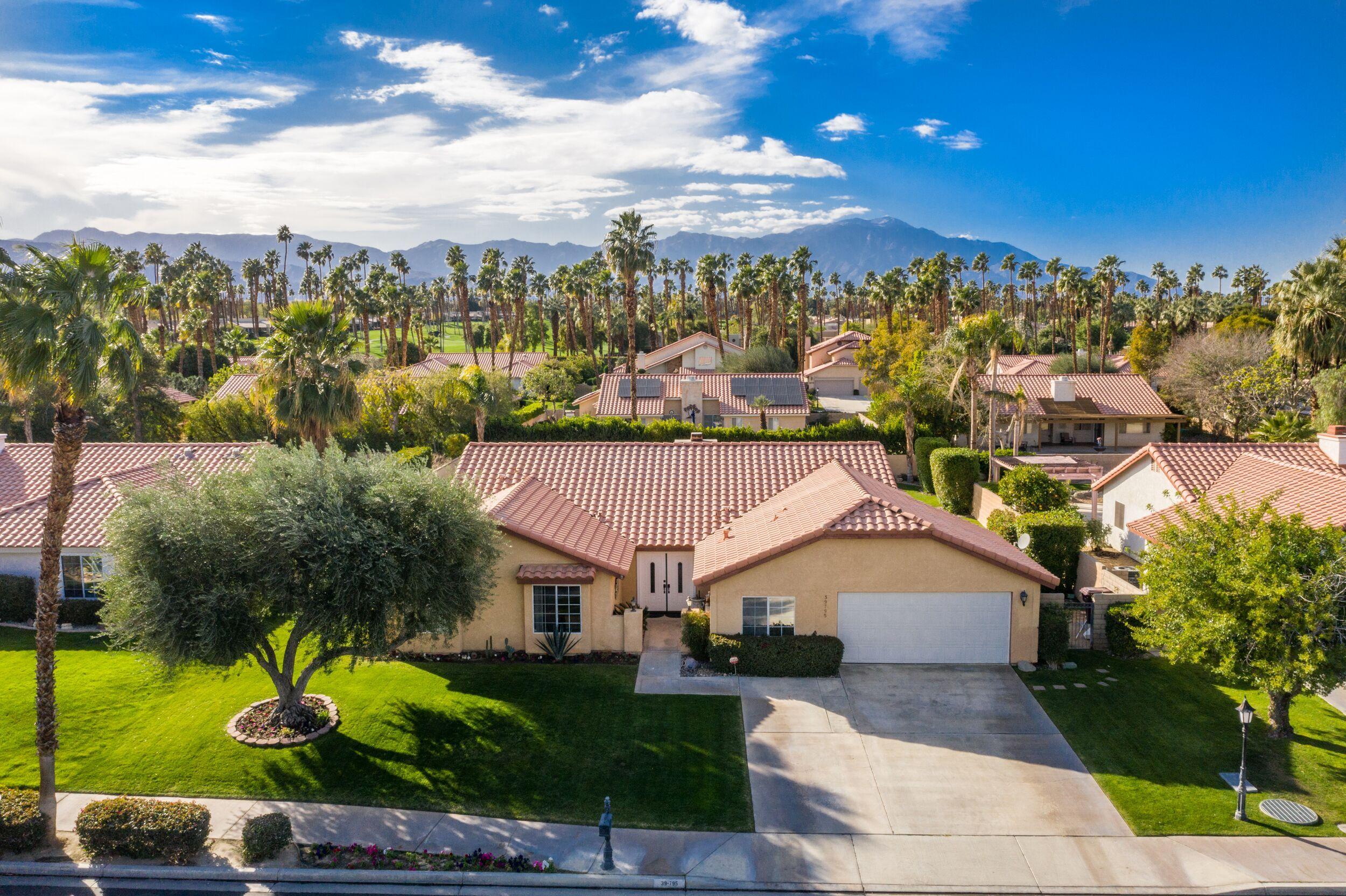 39795 Regency Way Palm Desert, CA 92211 - Photo 7 of 39 a view of a house with a yard and potted plants