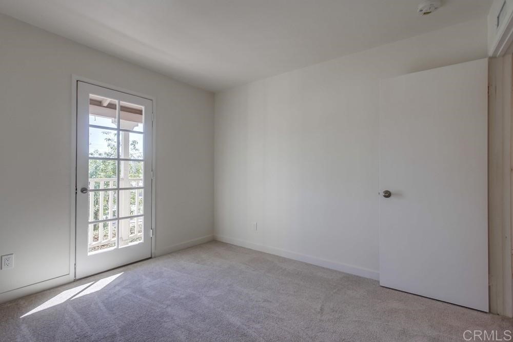 11941 Royal Road, Unit A El Cajon, CA 92021 - Photo 18 of 28 an empty room with windows