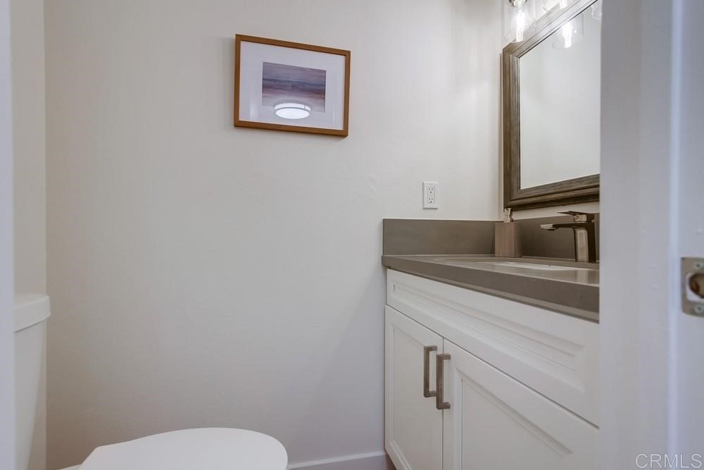 11941 Royal Road, Unit A El Cajon, CA 92021 - Photo 20 of 28 a bathroom with a toilet and a sink