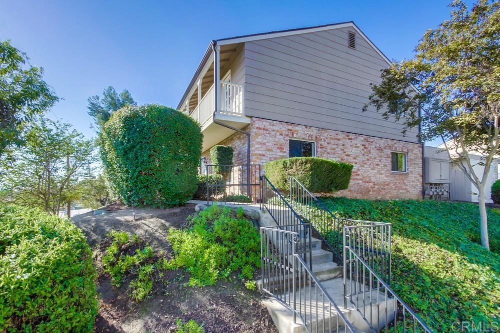 11941 Royal Road, Unit A El Cajon, CA 92021 - Photo 2 of 28 a front view of a house with garden