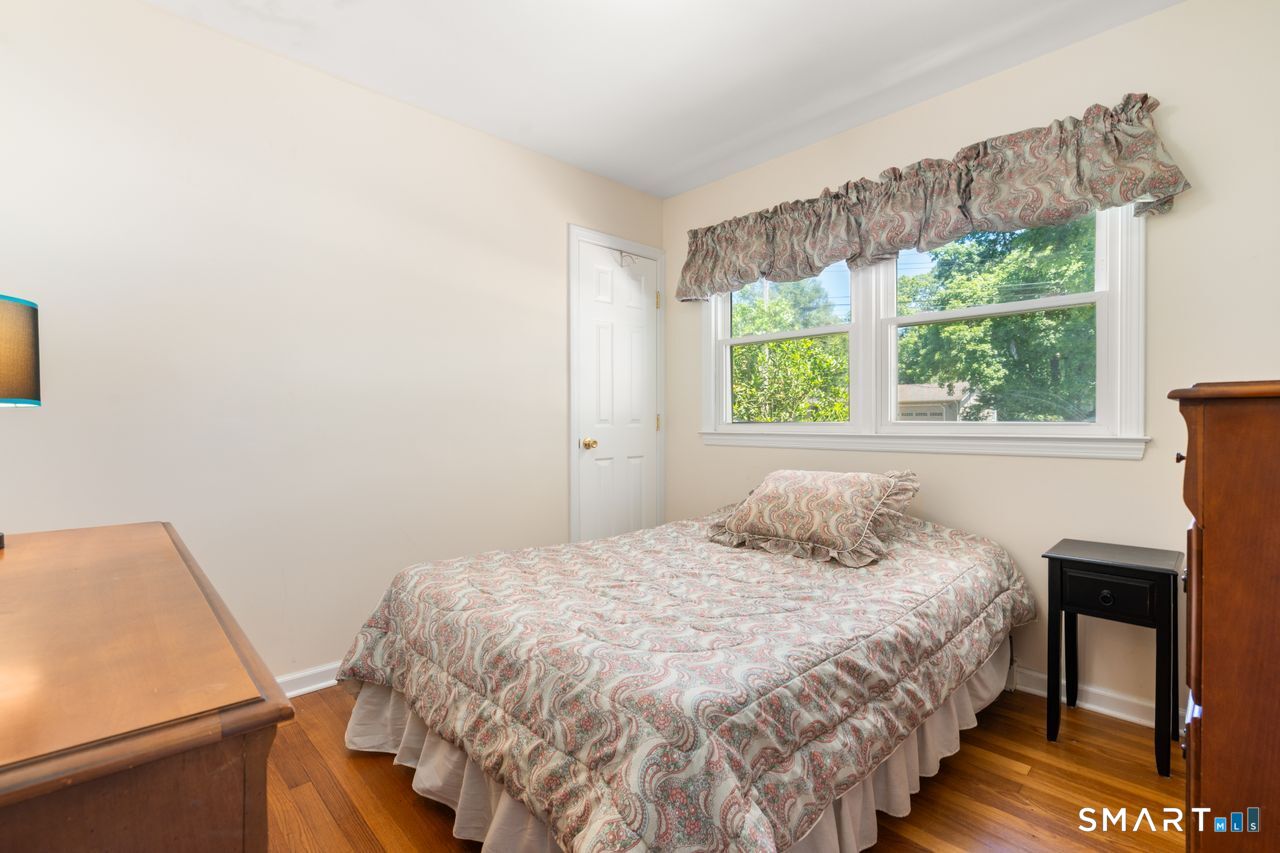 9 Stanton Road North Haven, CT 06473 - Photo 20 of 35 a bedroom with a bed and a window