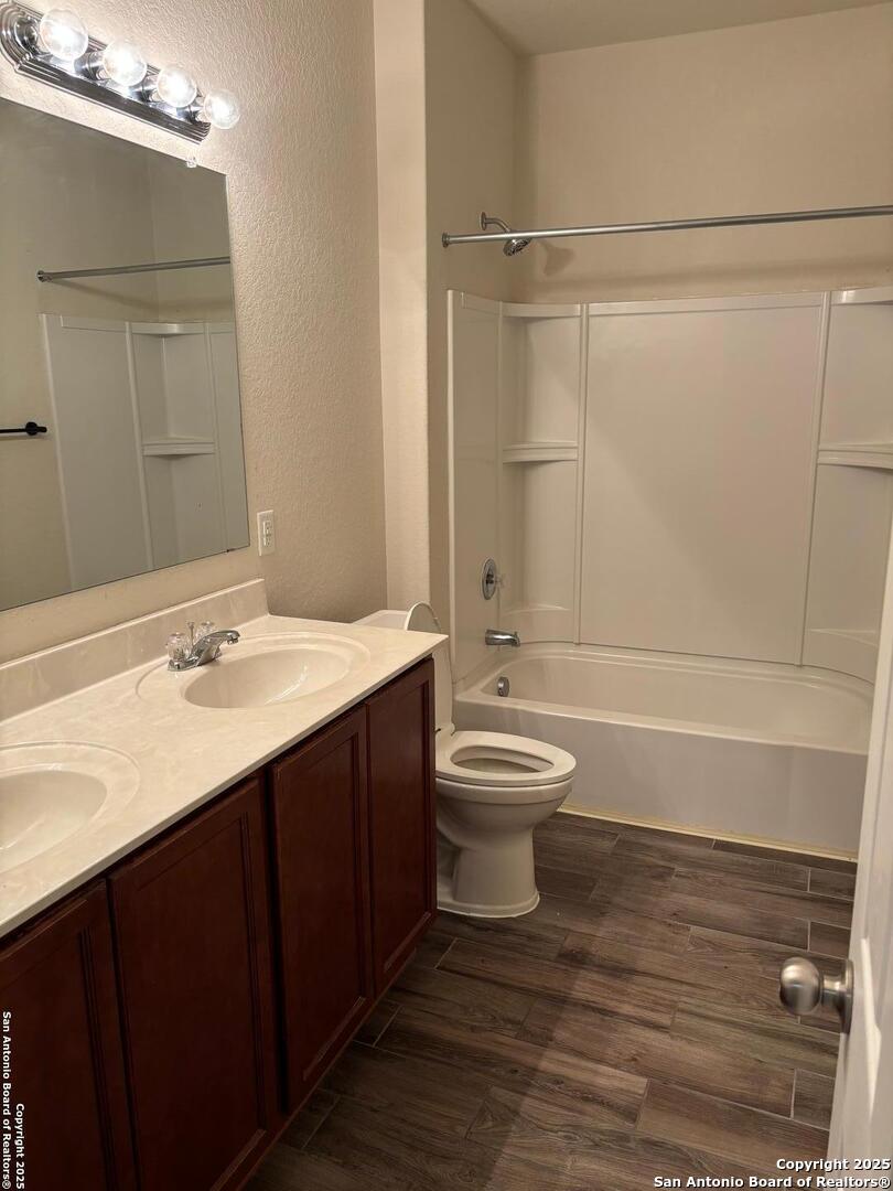 3711 Lazy Diamond Schertz, TX 78154 - Photo 11 of 20 a bathroom with a sink a toilet and shower