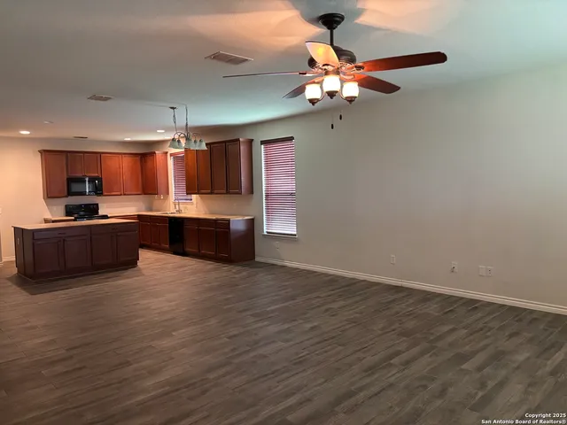 a view of kitchen with wooden floor