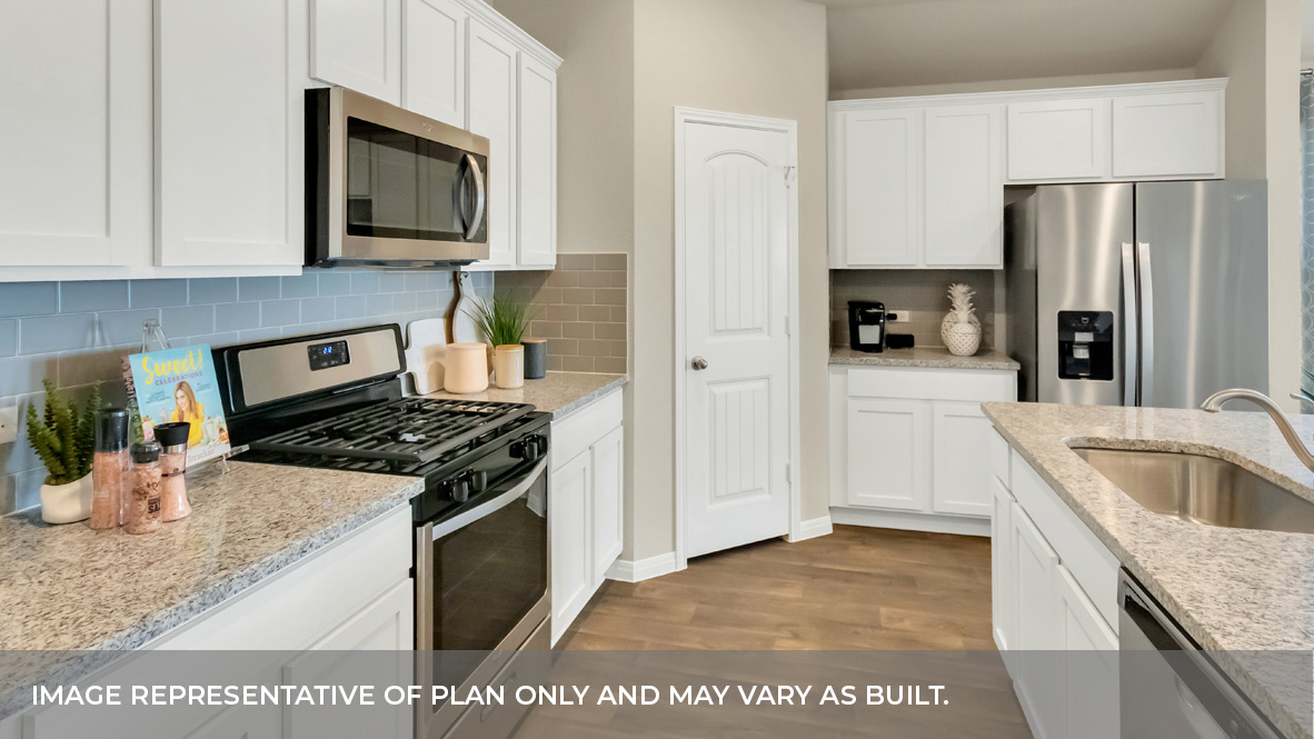 1905 Gold Dust Trail Leander, TX 78641 - Photo 13 of 28 a kitchen with stainless steel appliances granite countertop a sink stove and refrigerator
