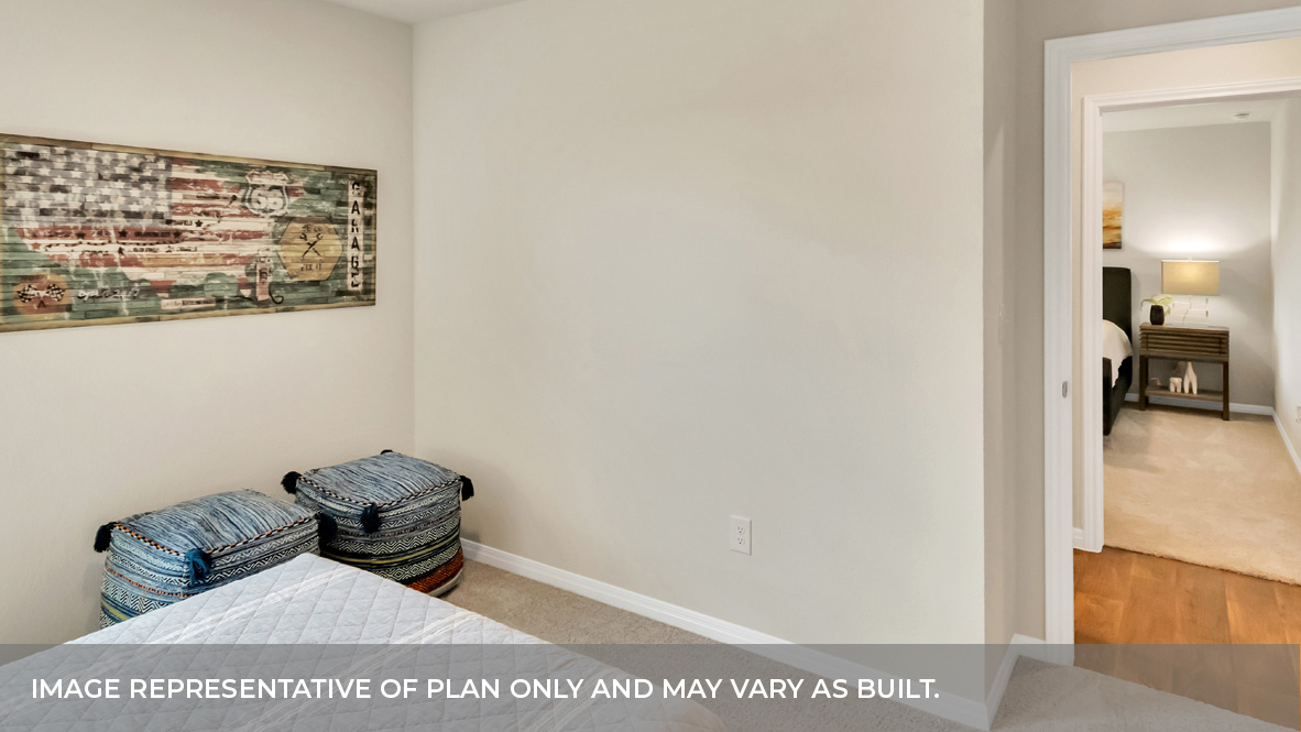 1905 Gold Dust Trail Leander, TX 78641 - Photo 22 of 28 a view of a bedroom with furniture and wooden floor