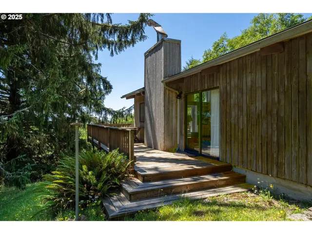 a view of deck with furniture and barbeque grill with wooden fence