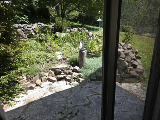a kitchen with wooden floors and wooden cabinets