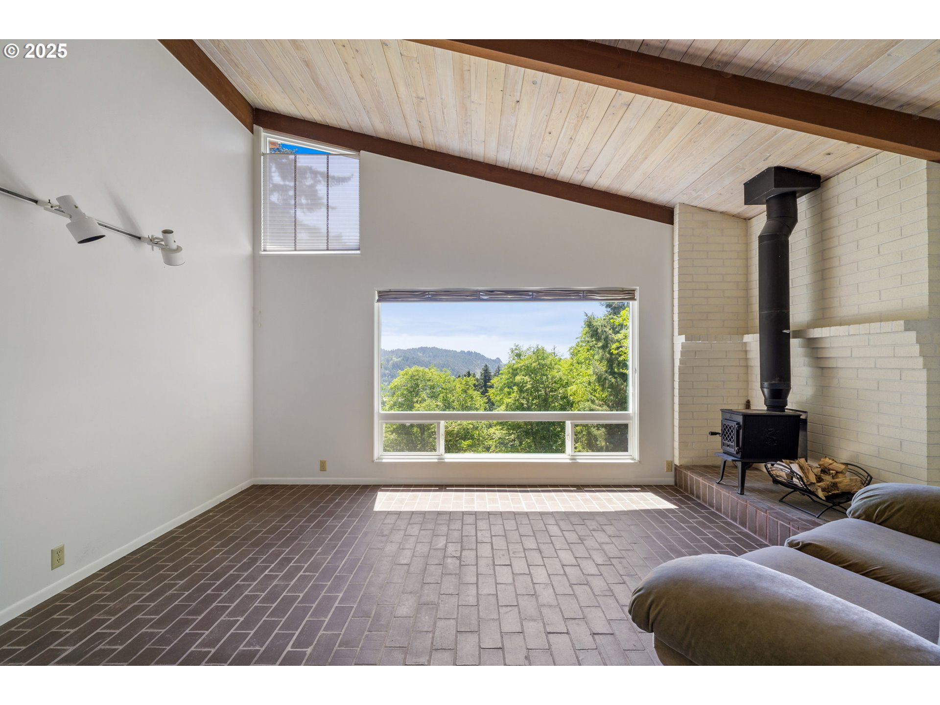 56100 High Point Road Otis, OR 97368 - Photo 21 of 47 a living room with furniture and a window