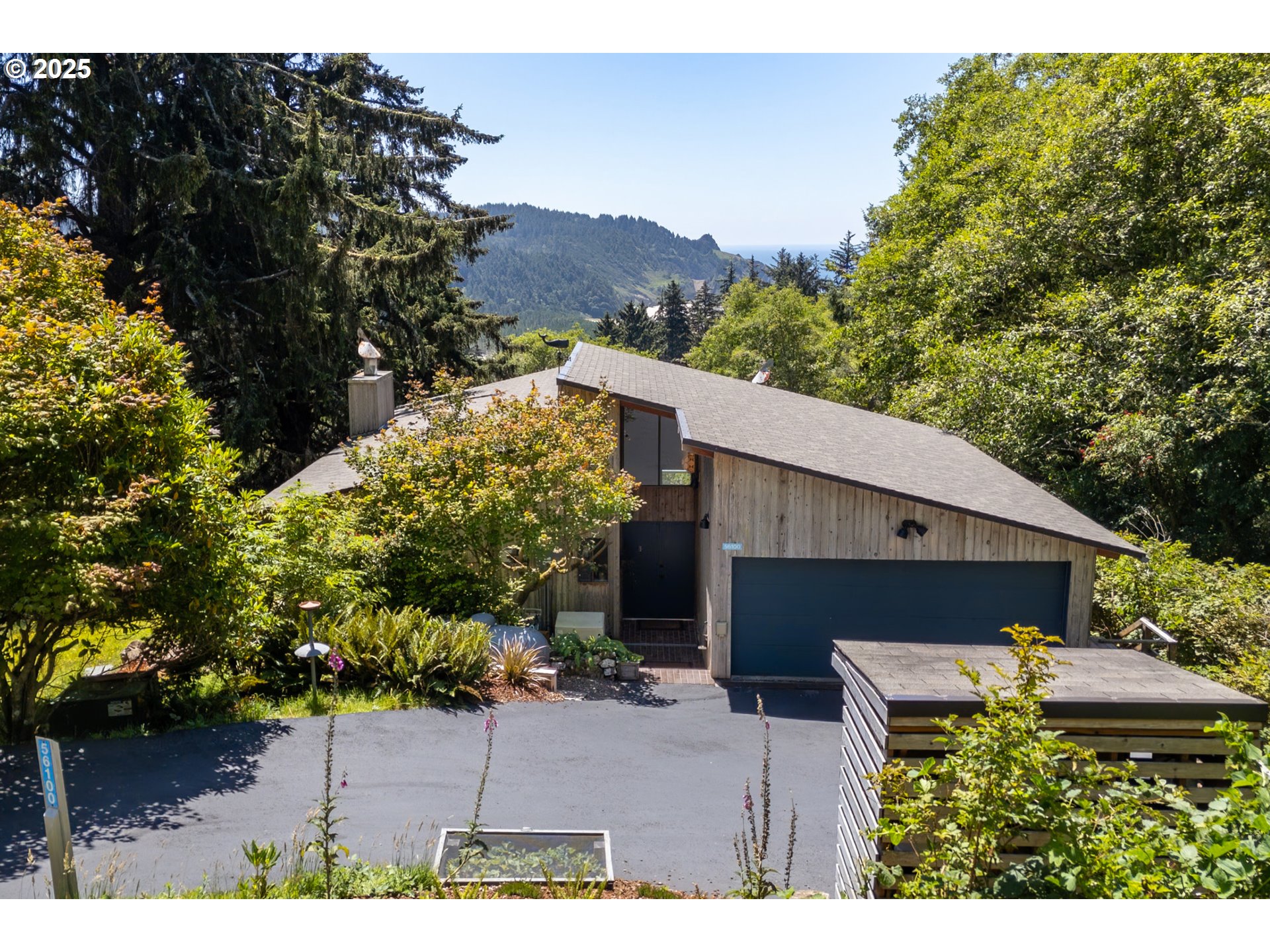 56100 High Point Road Otis, OR 97368 - Photo 4 of 47 a view of a house with a backyard