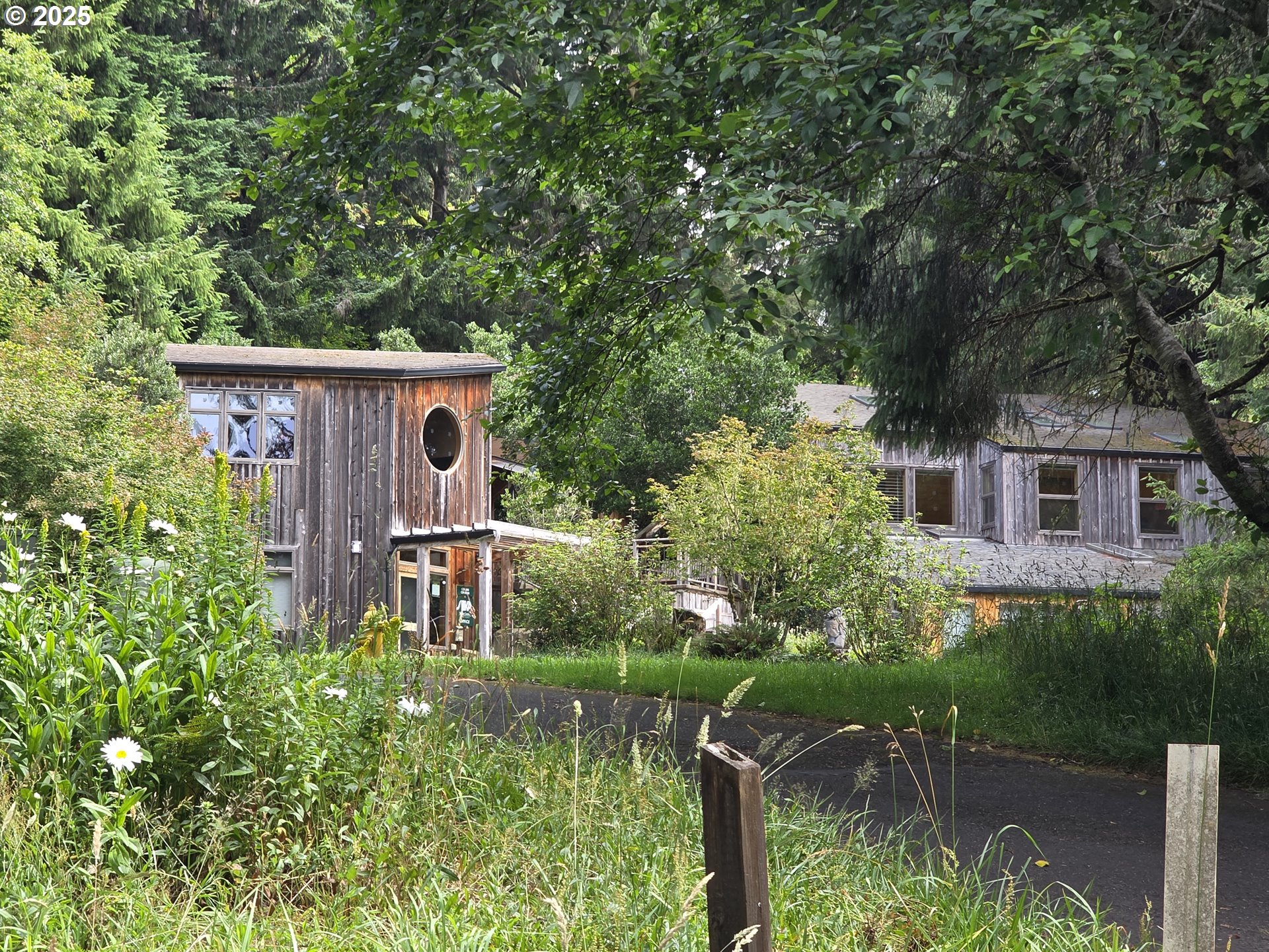 56100 High Point Road Otis, OR 97368 - Photo 45 of 47 front view of a house with a yard