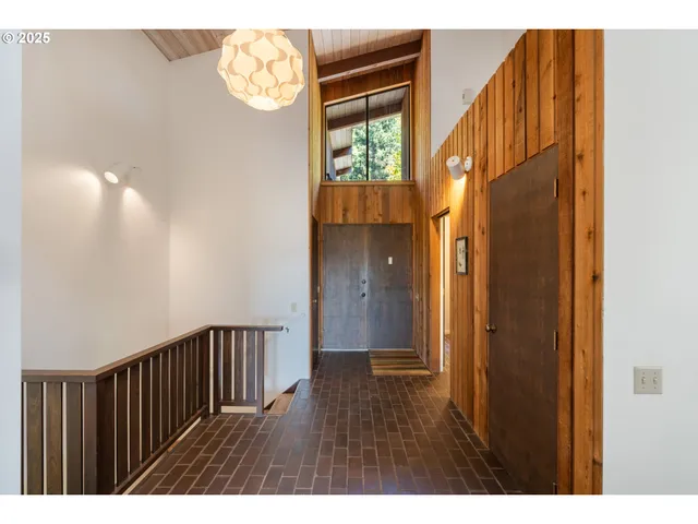 a view of entryway with wooden floor