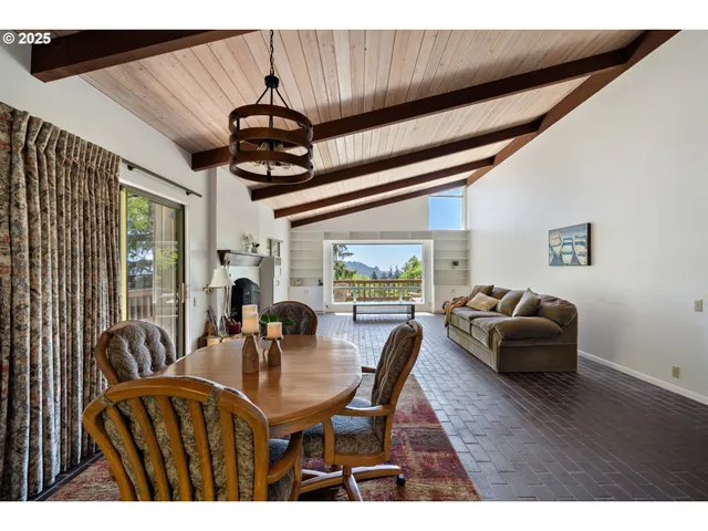 a work room with furniture and large windows