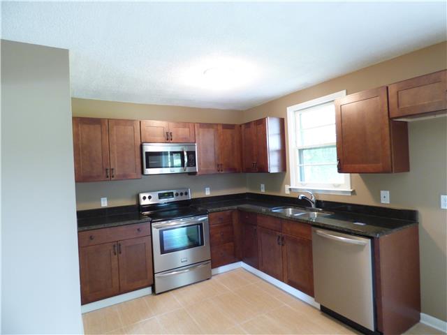 New kitchen with new cabinets, granite countertops, and new stainless steel appliances