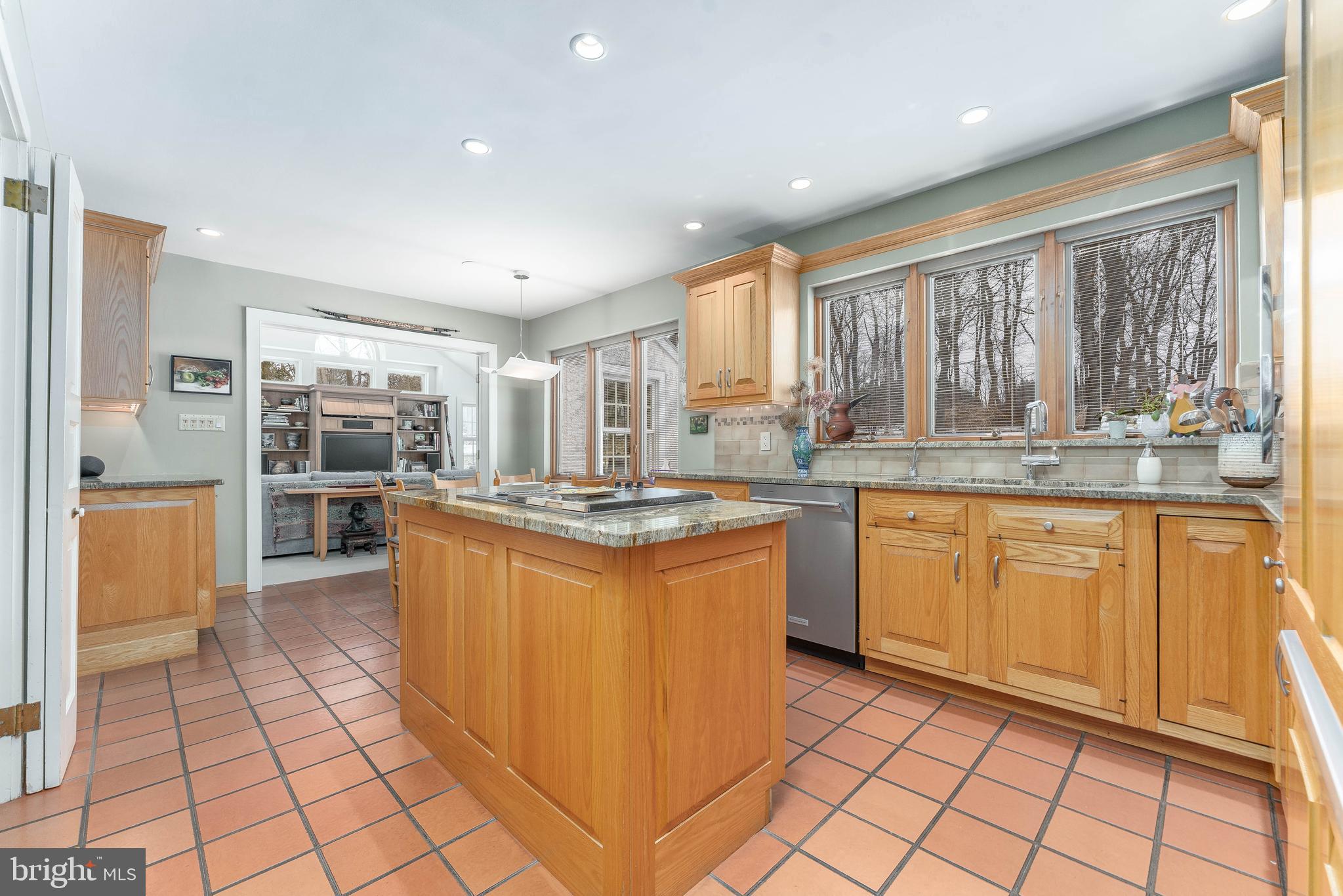 249 Bell Road Wynnewood, PA 19096 - Photo 16 of 76 a kitchen with stainless steel appliances granite countertop a stove a sink and a refrigerator