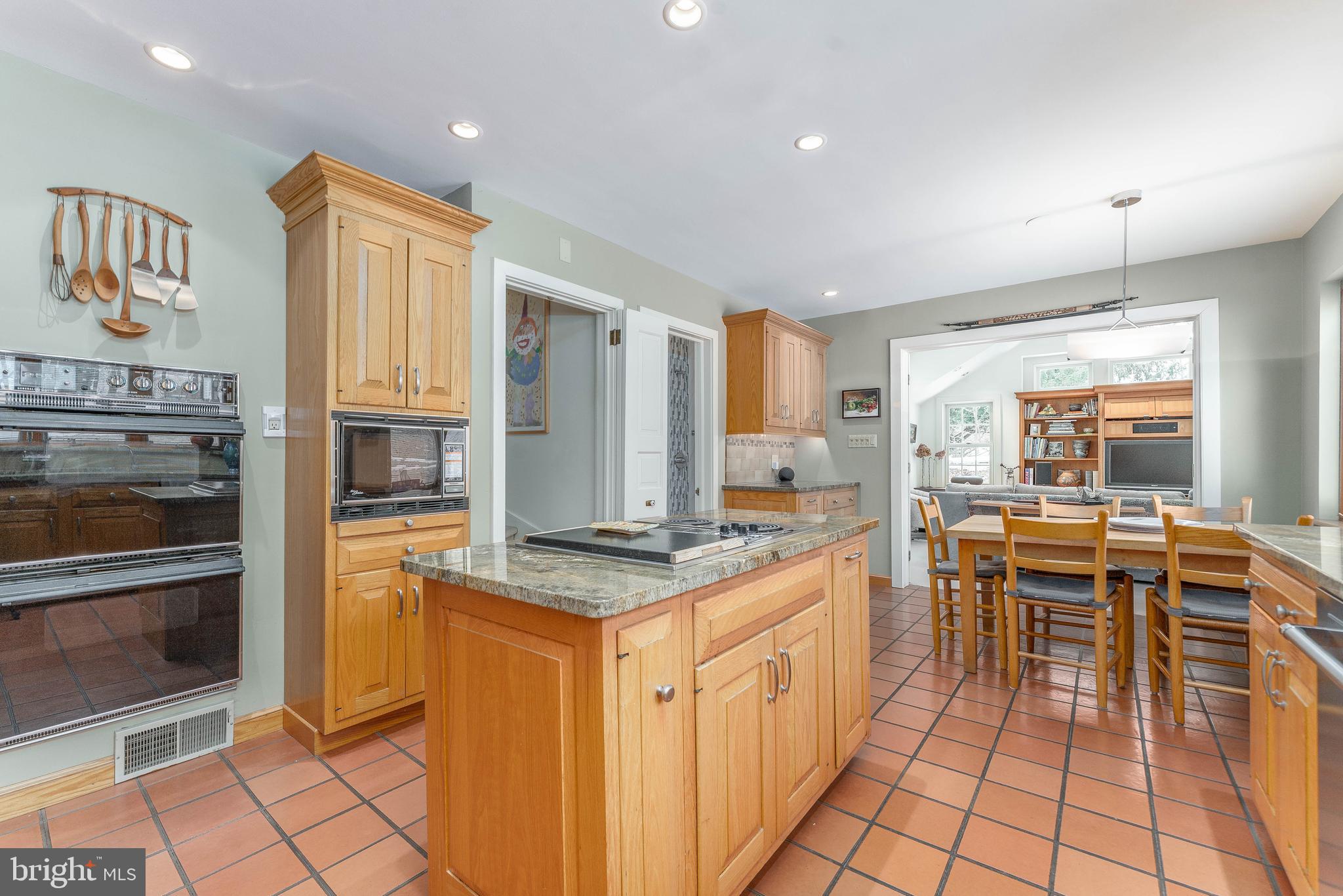 249 Bell Road Wynnewood, PA 19096 - Photo 17 of 76 a kitchen with stainless steel appliances granite countertop a stove top oven a sink dishwasher and a refrigerator