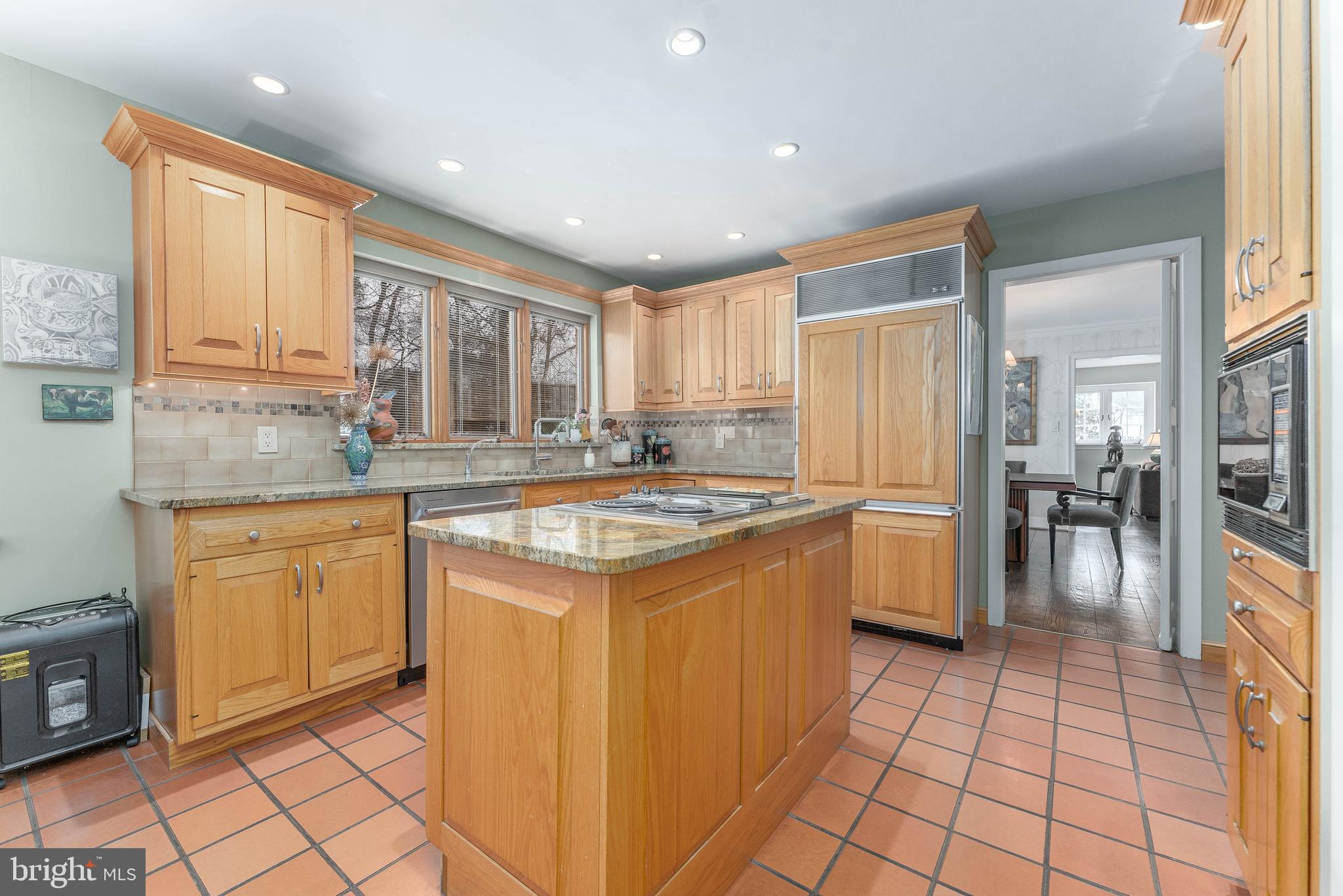 249 Bell Road Wynnewood, PA 19096 - Photo 18 of 76 a kitchen with stainless steel appliances granite countertop a stove a sink and a refrigerator