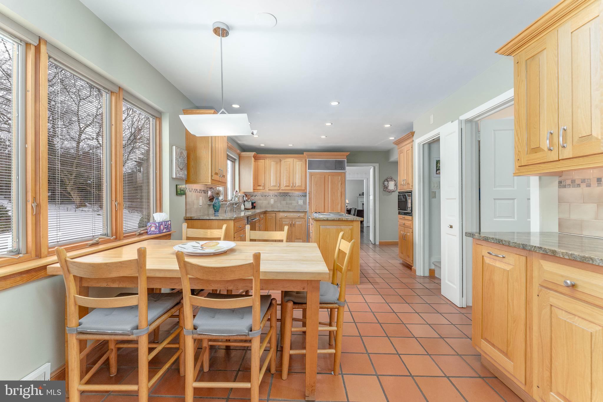 249 Bell Road Wynnewood, PA 19096 - Photo 21 of 76 a view of a dining room with furniture large windows and wooden floor