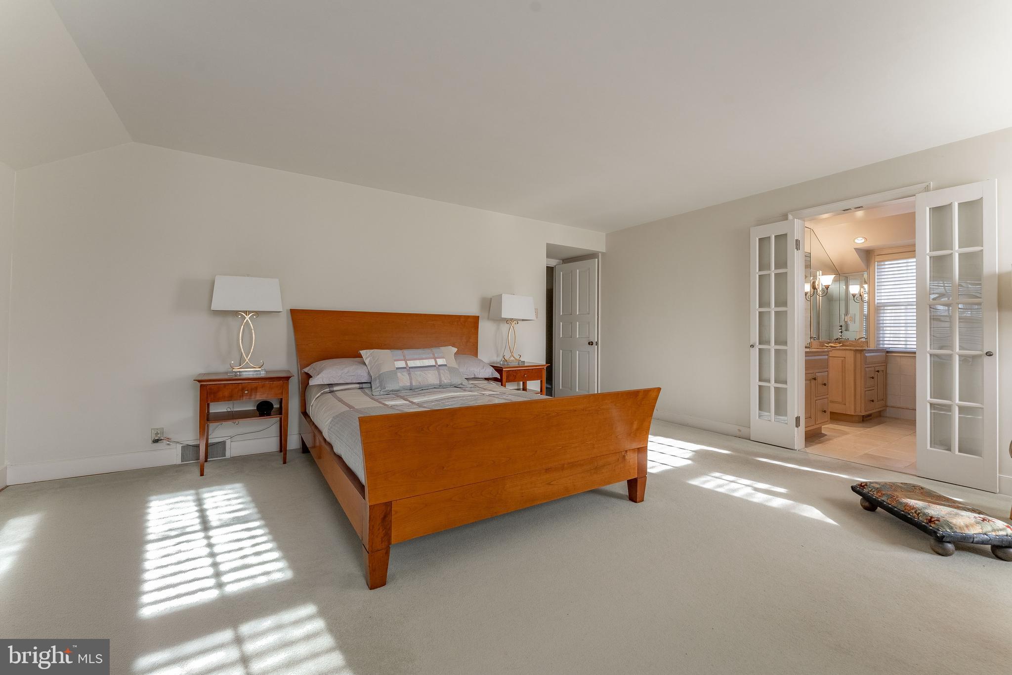 249 Bell Road Wynnewood, PA 19096 - Photo 35 of 76 a bedroom with a bed and glass door