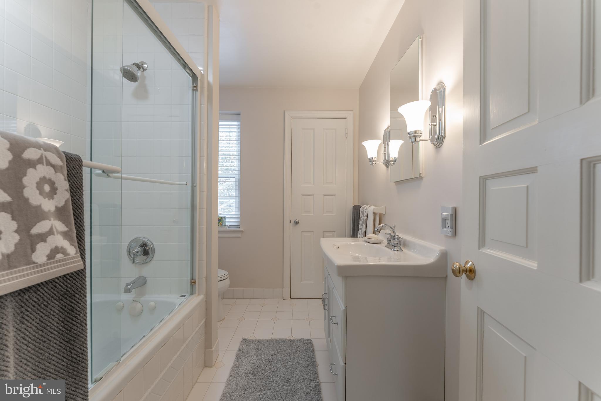 249 Bell Road Wynnewood, PA 19096 - Photo 51 of 76 a bathroom with a tub sink and mirror