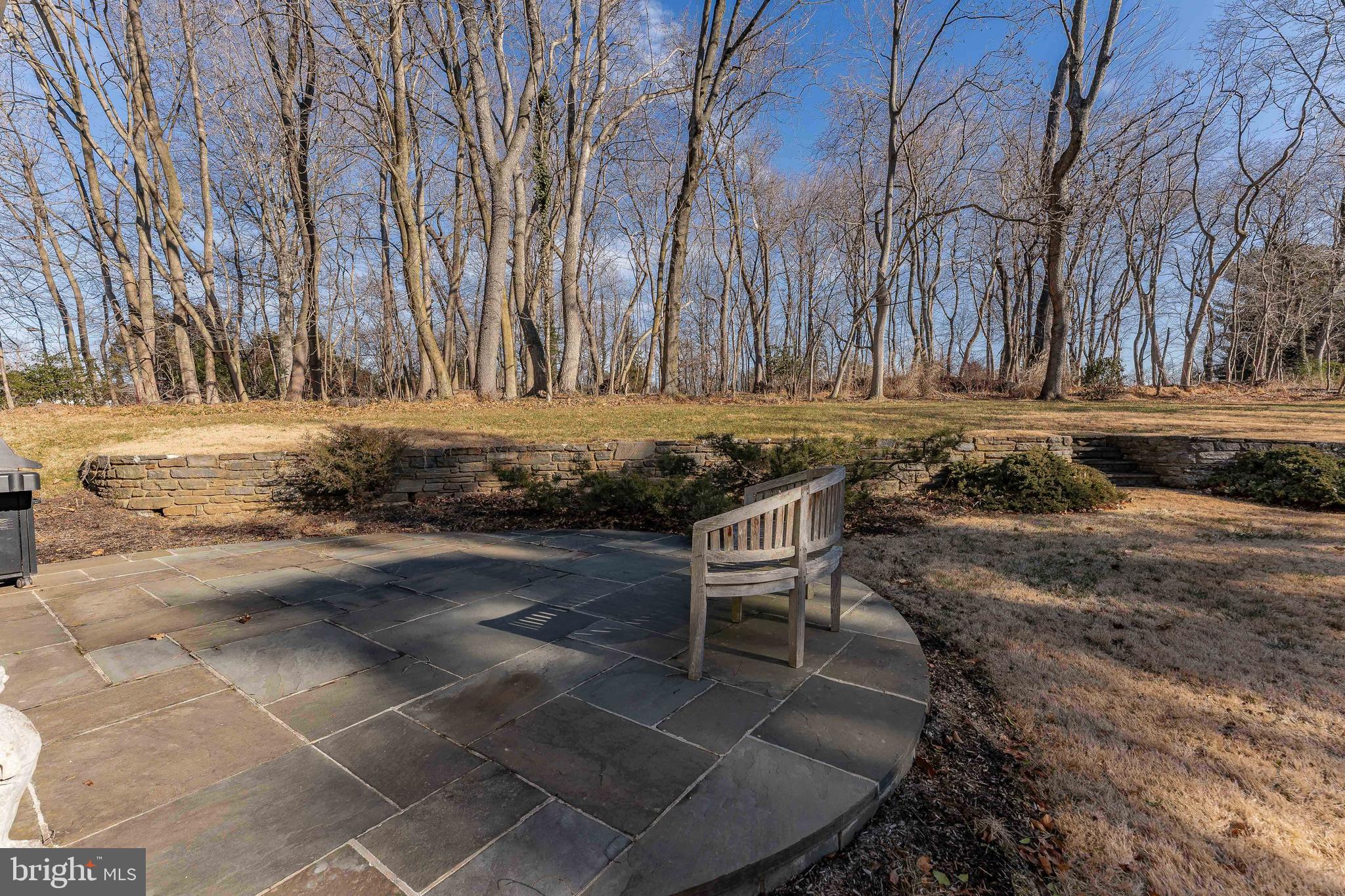 249 Bell Road Wynnewood, PA 19096 - Photo 67 of 76 a backyard of a house with trees and outdoor seating