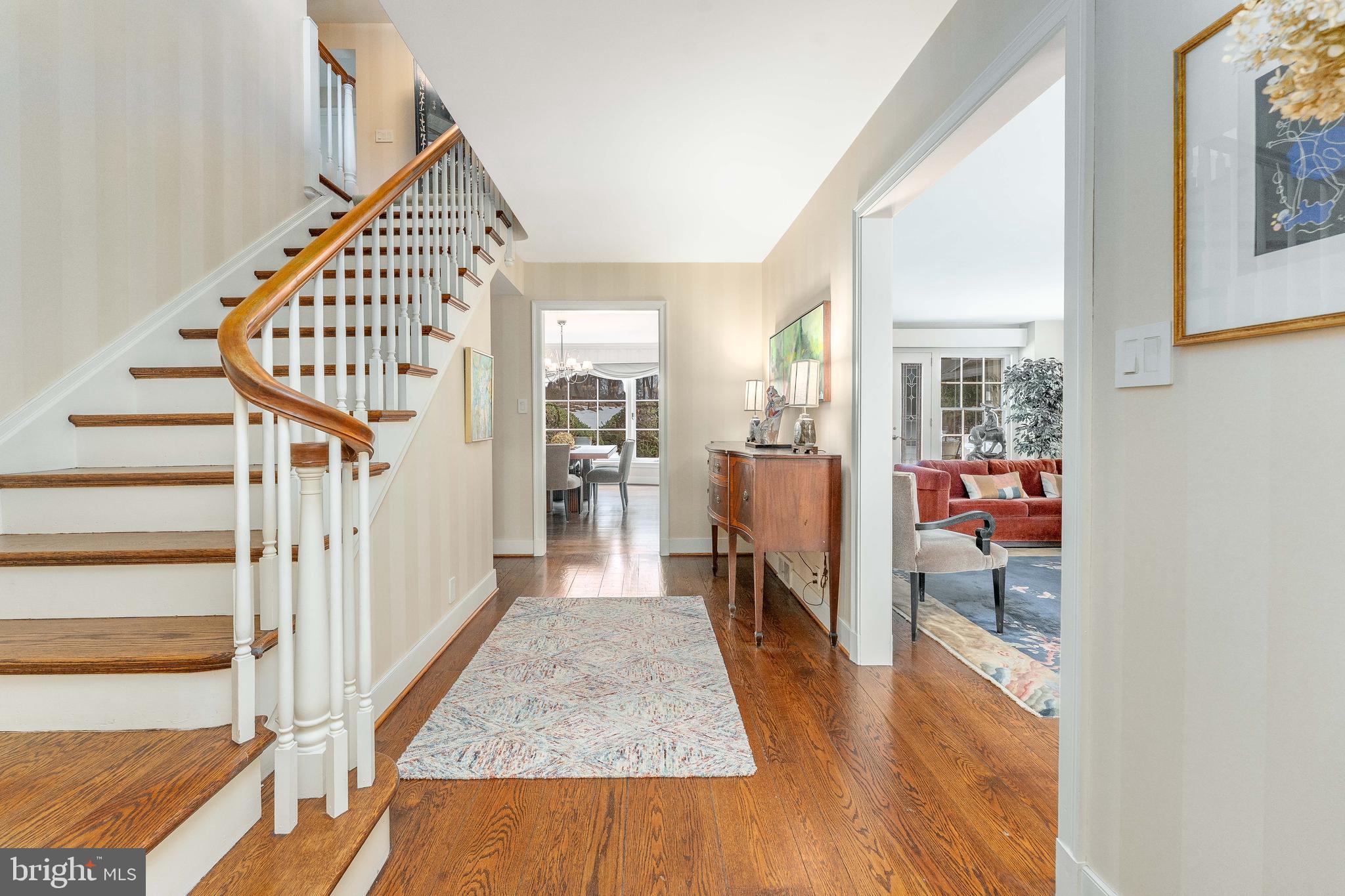 249 Bell Road Wynnewood, PA 19096 - Photo 7 of 76 a view of a hallway with wooden floor and staircase