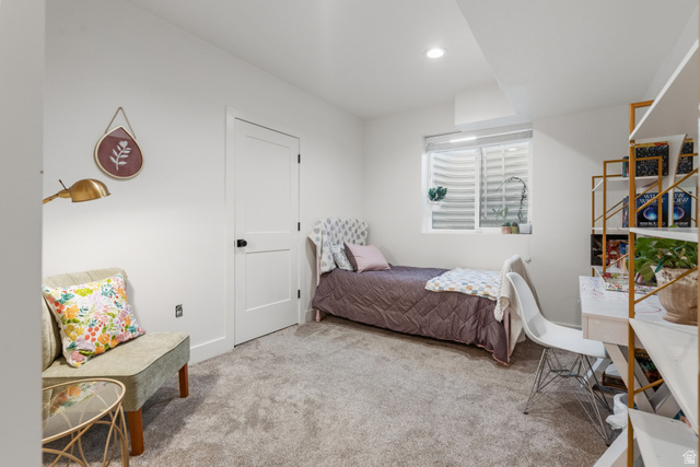 2013 South 100 West Perry, UT 84302 - Photo 34 of 49 Carpeted room with a white door, recessed lighting, and a well window featuring horizontal blinds