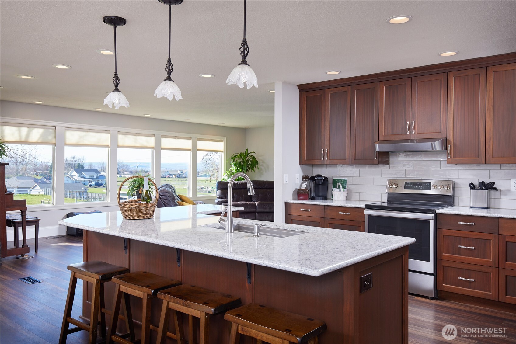 371 Hill Road Walla Walla, WA 99362 - Photo 20 of 40 a kitchen with granite countertop a stove a sink a dining table and chairs