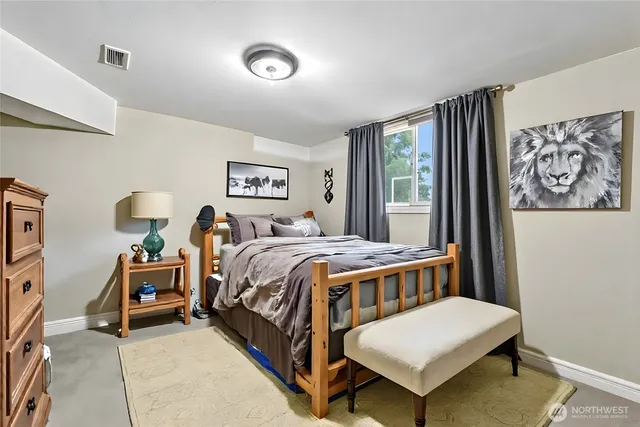 a bedroom with a bed and a table in it