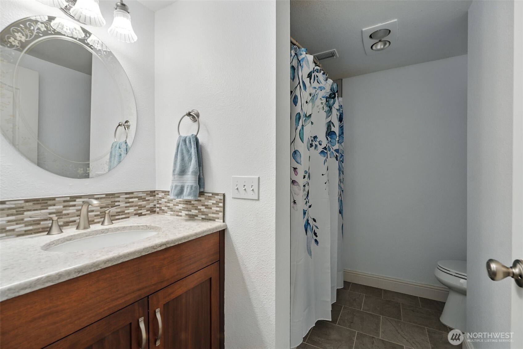 371 Hill Road Walla Walla, WA 99362 - Photo 29 of 40 a bathroom with a sink and a mirror