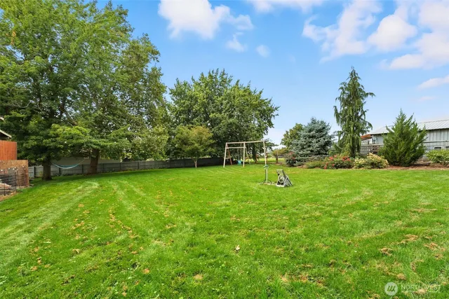 a view of an house with backyard space and garden
