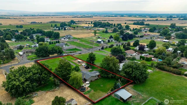 an aerial view of river residential houses with outdoor space and swimming pool