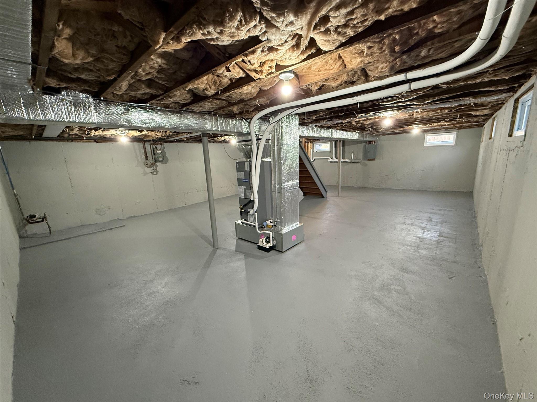 661 College Road Farmingville, NY 11738 - Photo 13 of 19 Below grade area featuring heating unit and electric panel