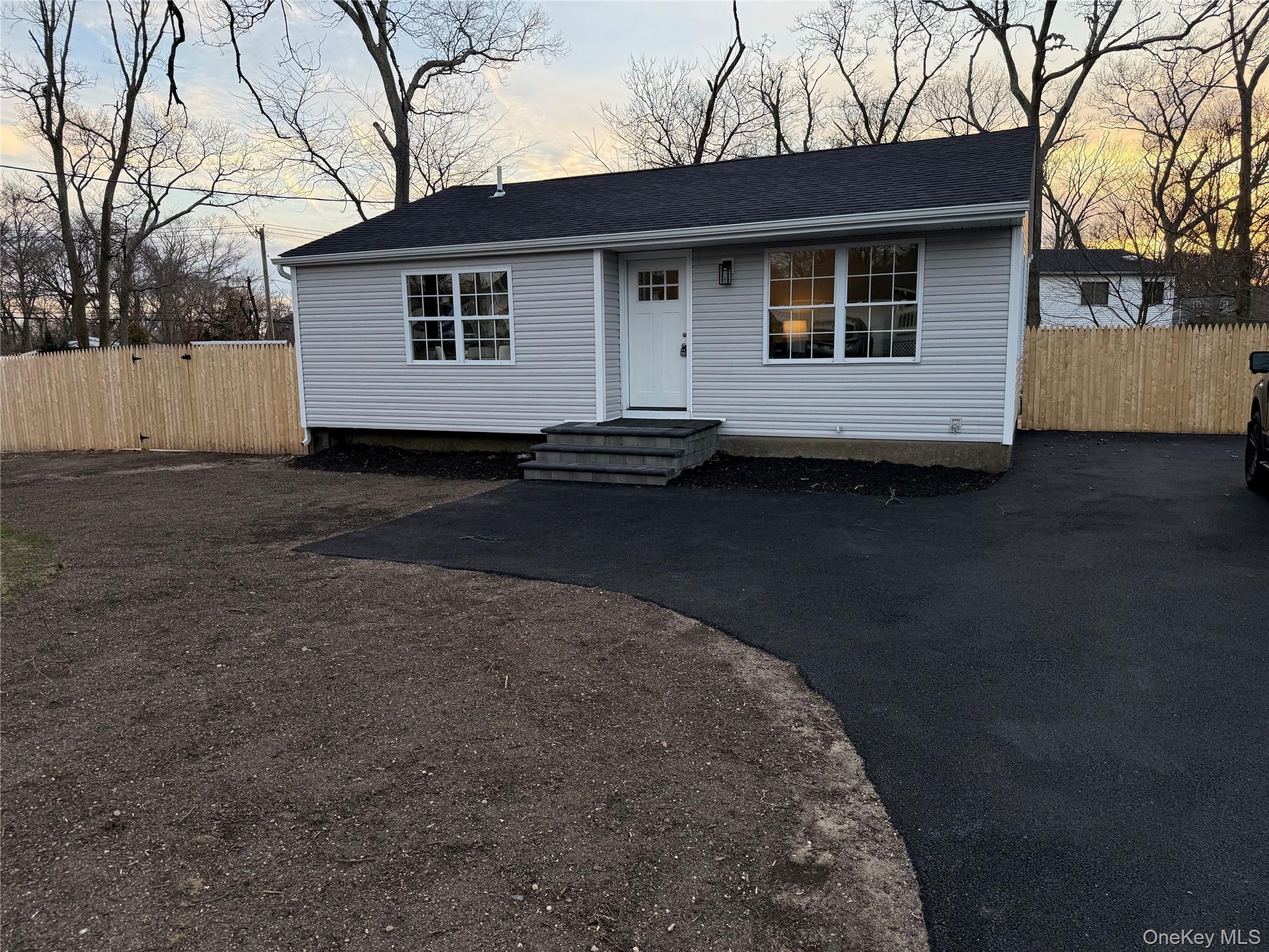 661 College Road Farmingville, NY 11738 - Photo 2 of 19 View of front of property featuring roof with shingles and driveway