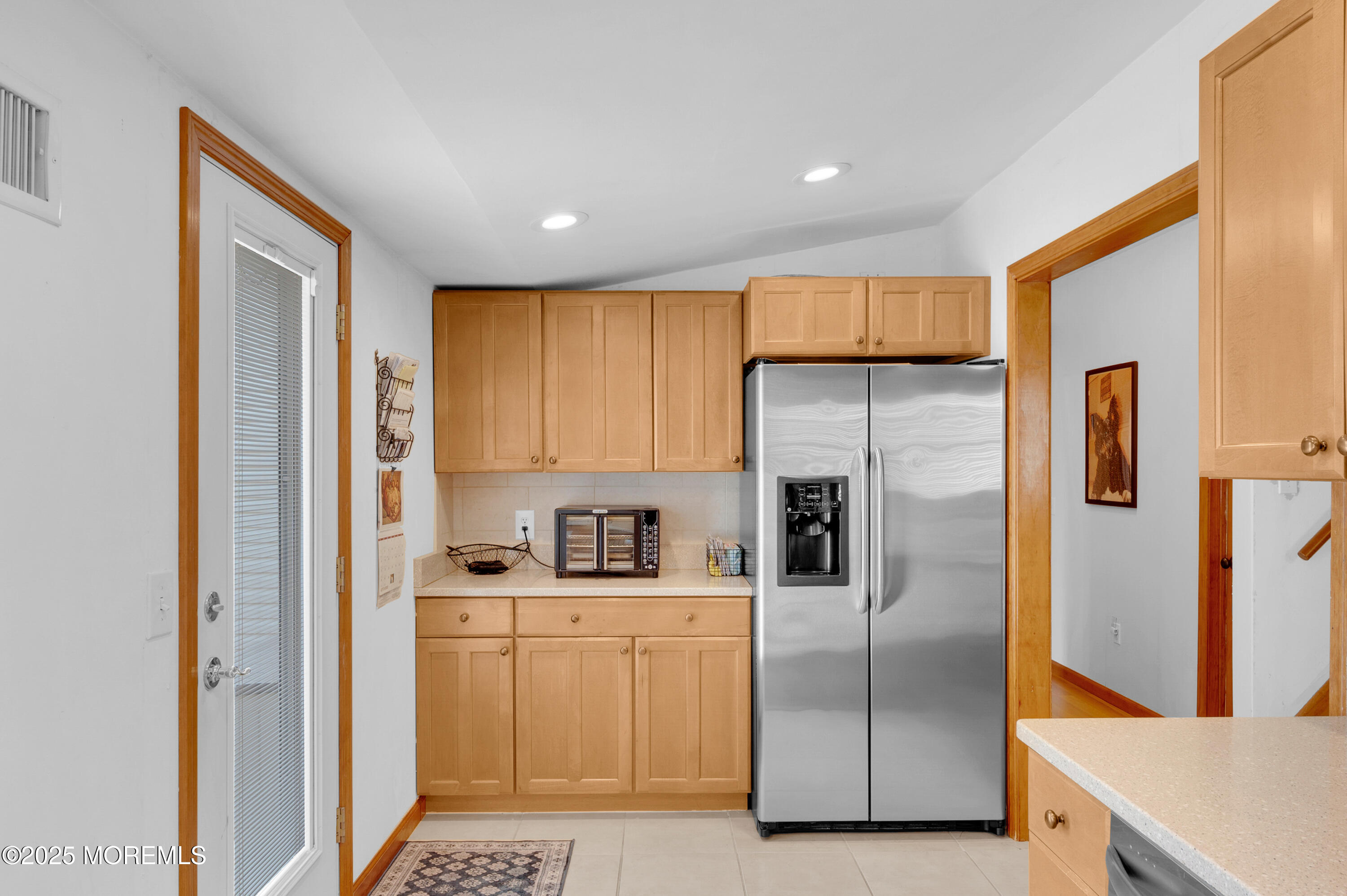 2121 Foster Road Point Pleasant, NJ 08742 - Photo 14 of 47 a kitchen with white cabinets and stainless steel appliances