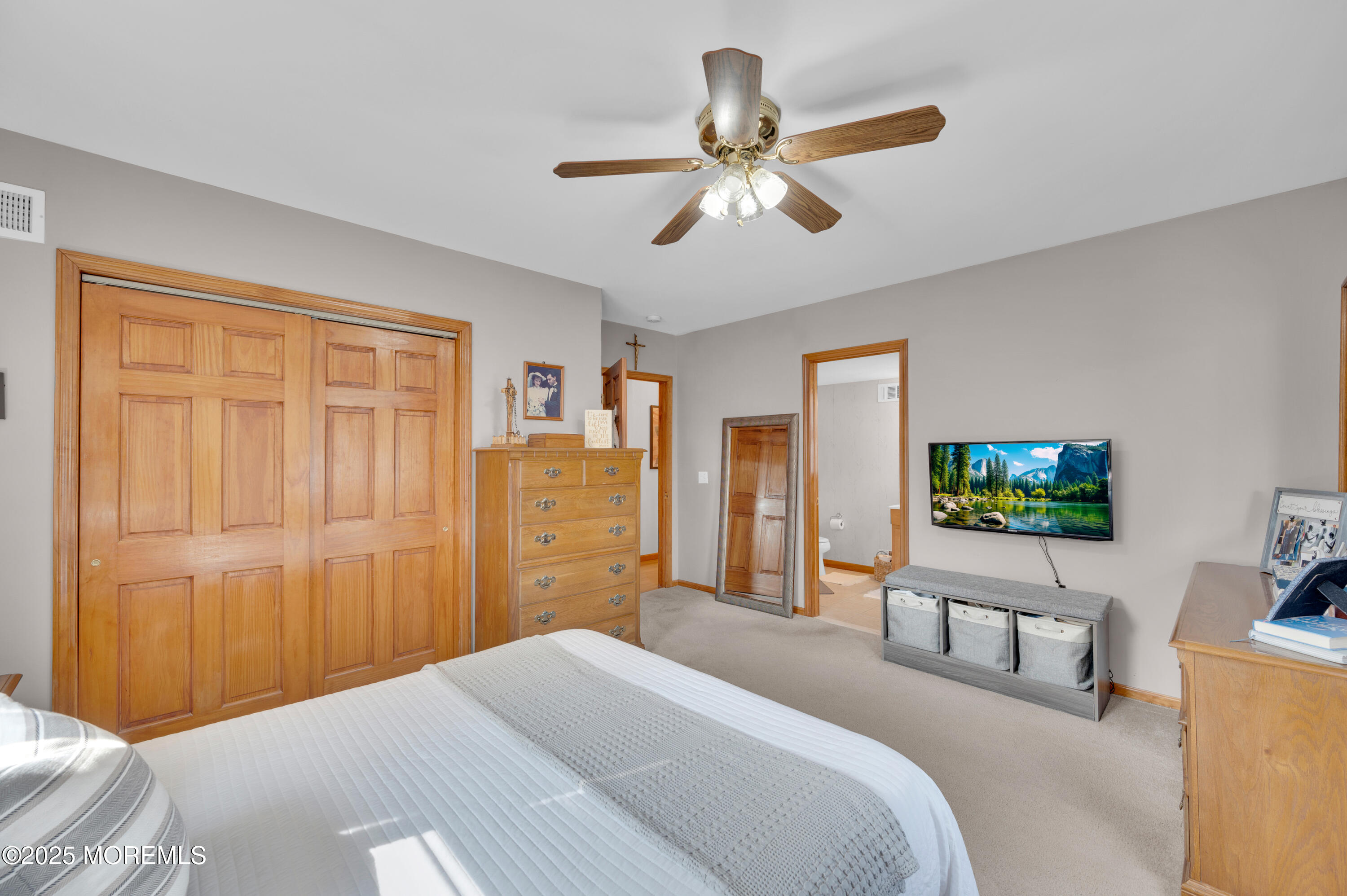 2121 Foster Road Point Pleasant, NJ 08742 - Photo 18 of 47 a bedroom with a bed and a flat screen tv