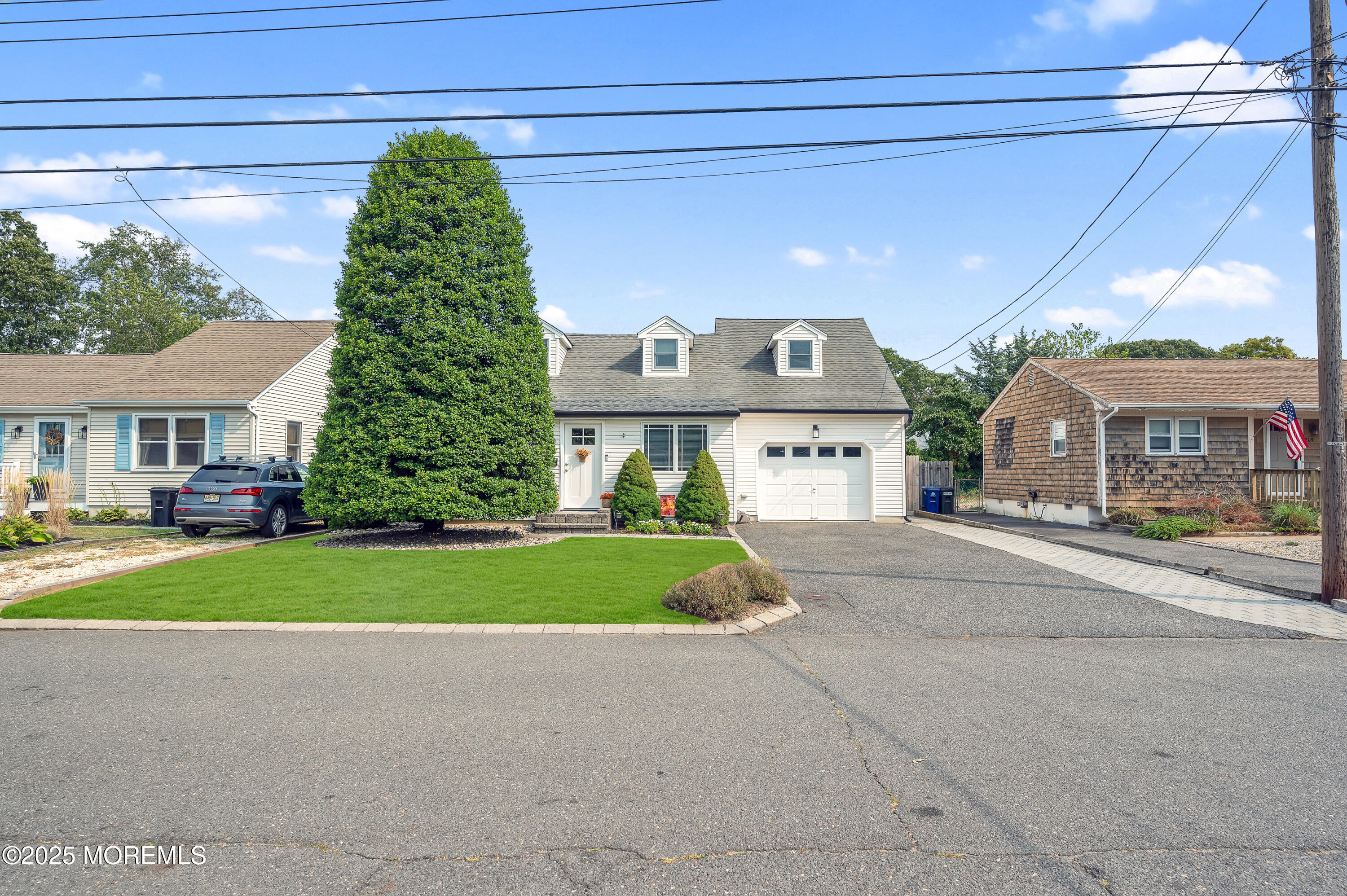 2121 Foster Road Point Pleasant, NJ 08742 - Photo 32 of 47 a front view of a house with a yard and garage