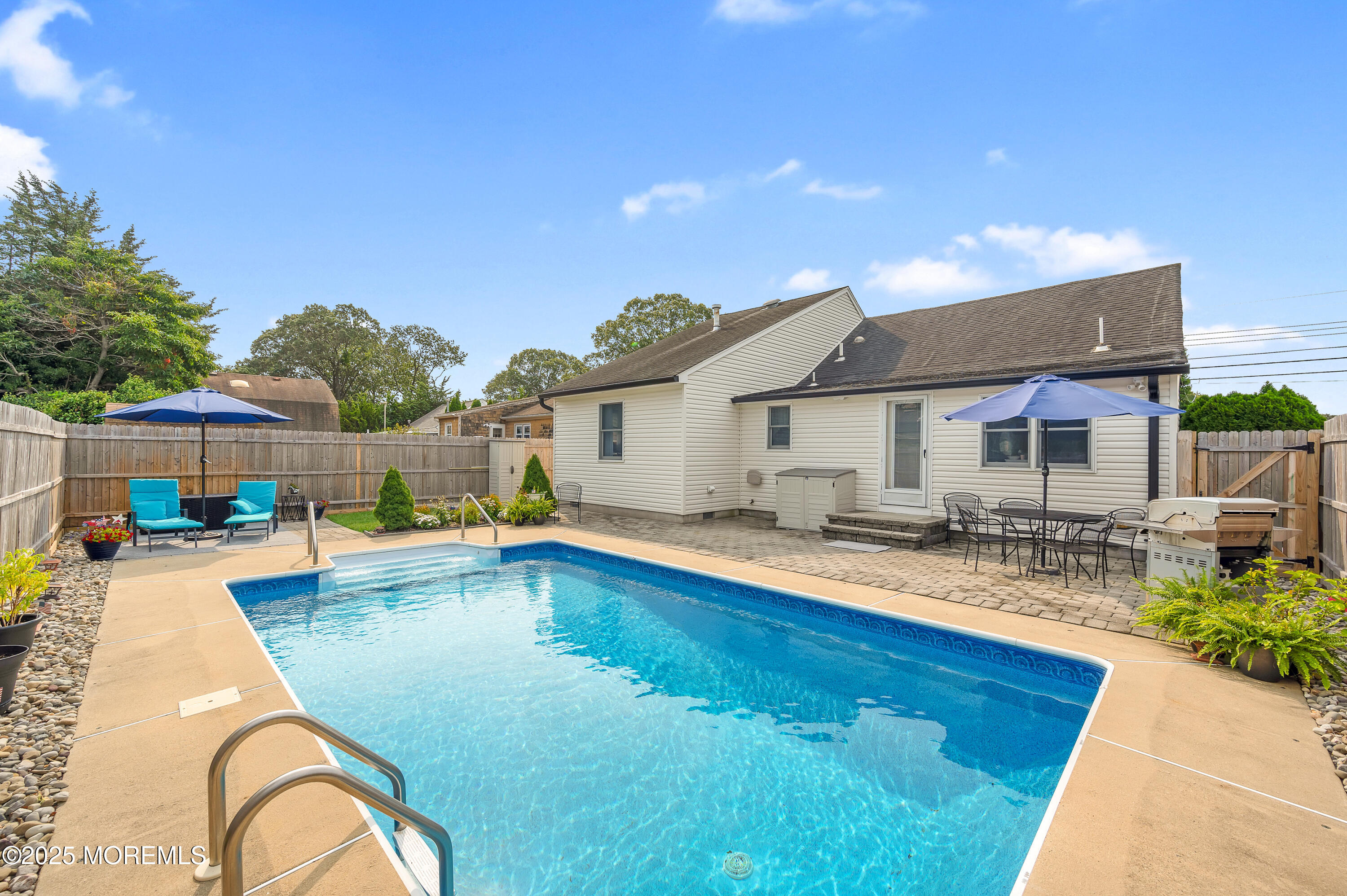 2121 Foster Road Point Pleasant, NJ 08742 - Photo 35 of 47 a swimming pool with outdoor seating yard and barbeque oven