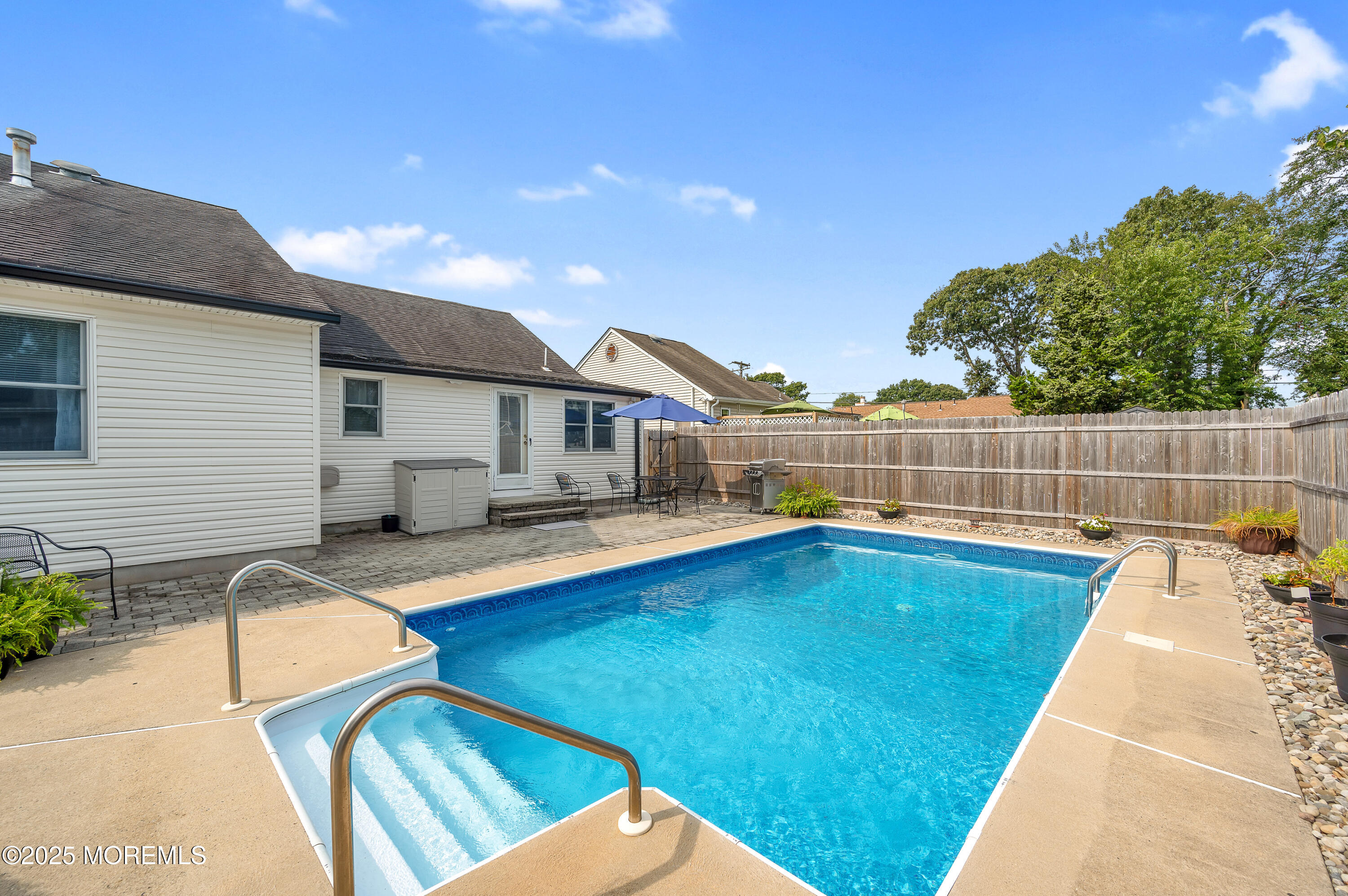 2121 Foster Road Point Pleasant, NJ 08742 - Photo 36 of 47 a view of swimming pool with seating area