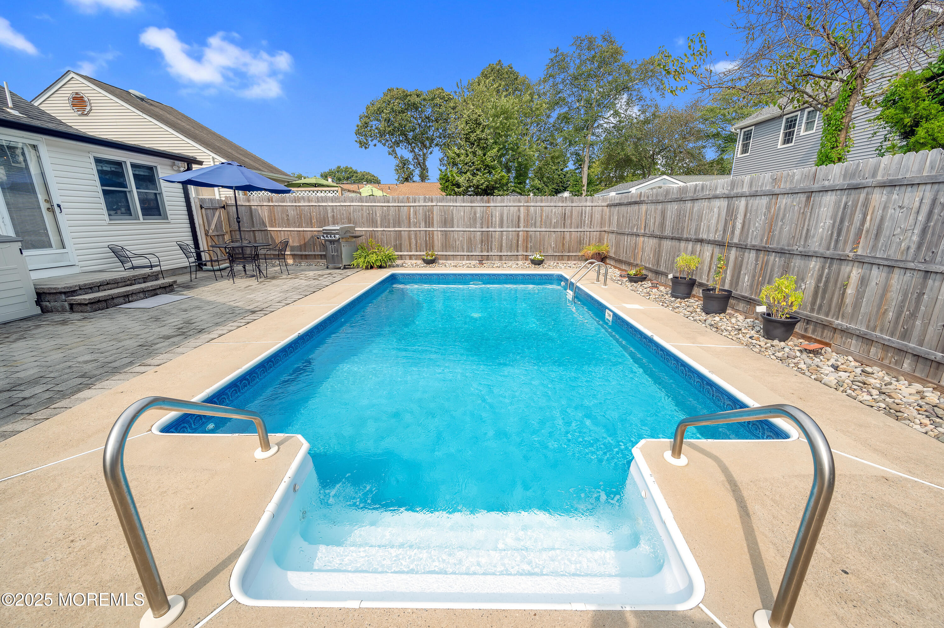 2121 Foster Road Point Pleasant, NJ 08742 - Photo 37 of 47 a view of a backyard with swimming pool