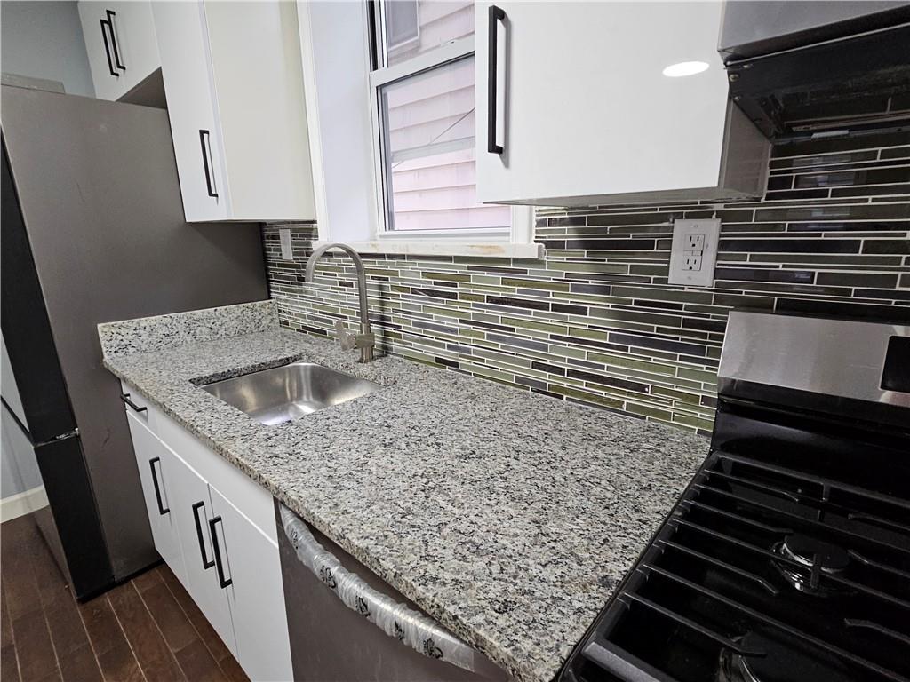 516 Jackson Street Rochester, PA 15074 - Photo 11 of 30 a kitchen with a sink and cabinets
