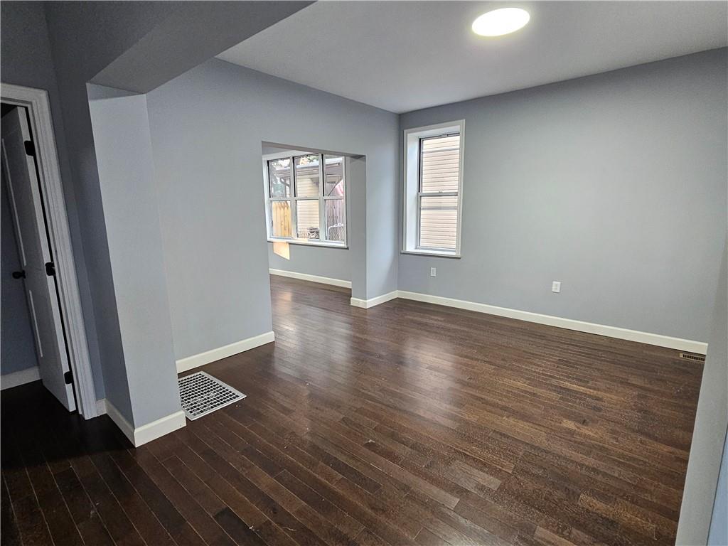 516 Jackson Street Rochester, PA 15074 - Photo 22 of 30 an empty room with wooden floor and windows
