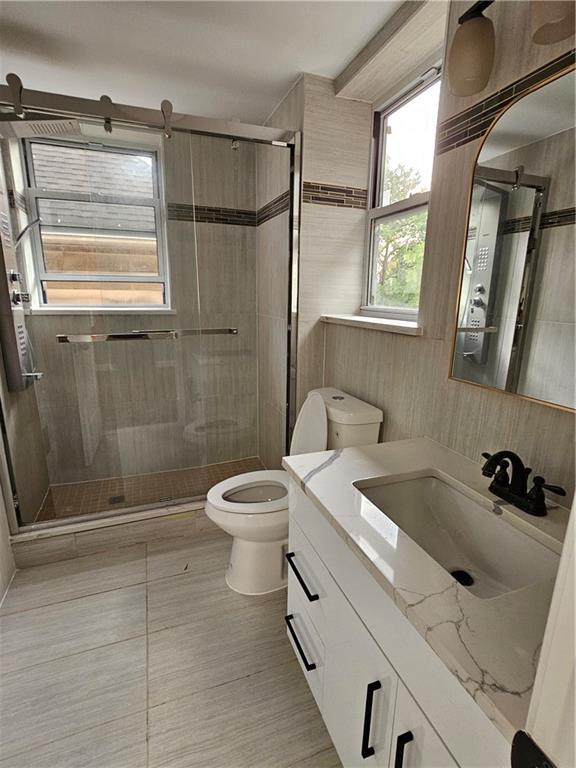 516 Jackson Street Rochester, PA 15074 - Photo 24 of 30 a bathroom with a sink a toilet and shower