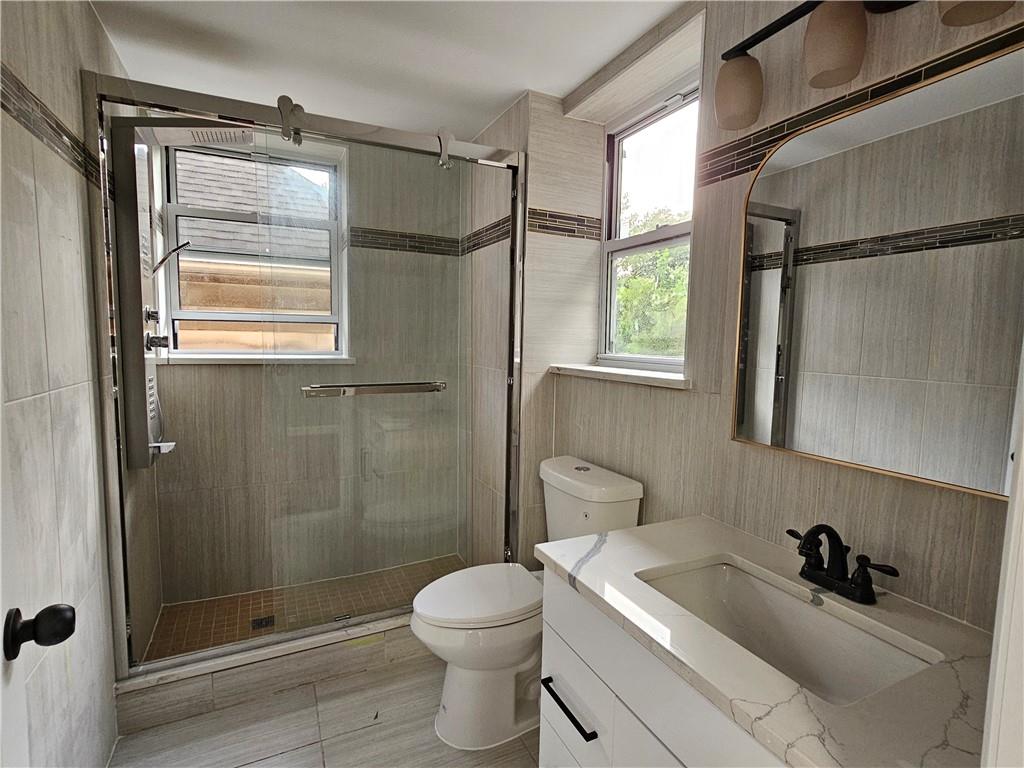 516 Jackson Street Rochester, PA 15074 - Photo 26 of 30 a bathroom with a sink toilet and shower