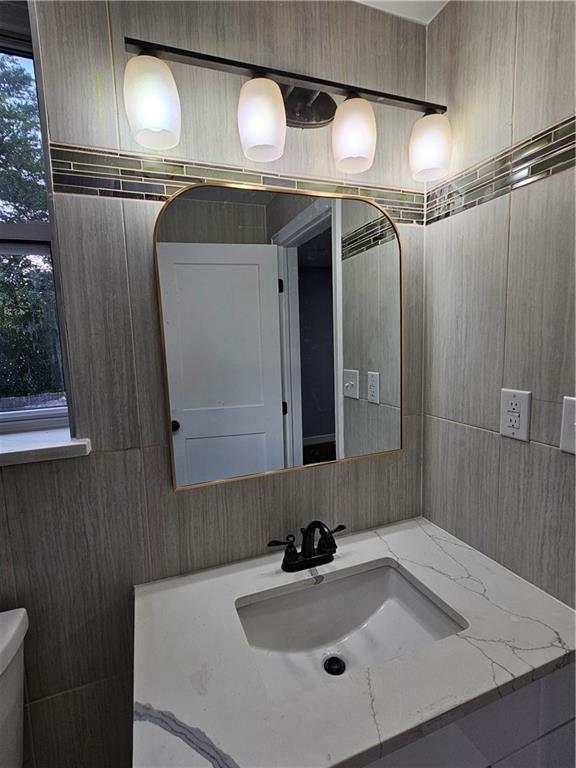 516 Jackson Street Rochester, PA 15074 - Photo 27 of 30 a bathroom with a sink and a mirror